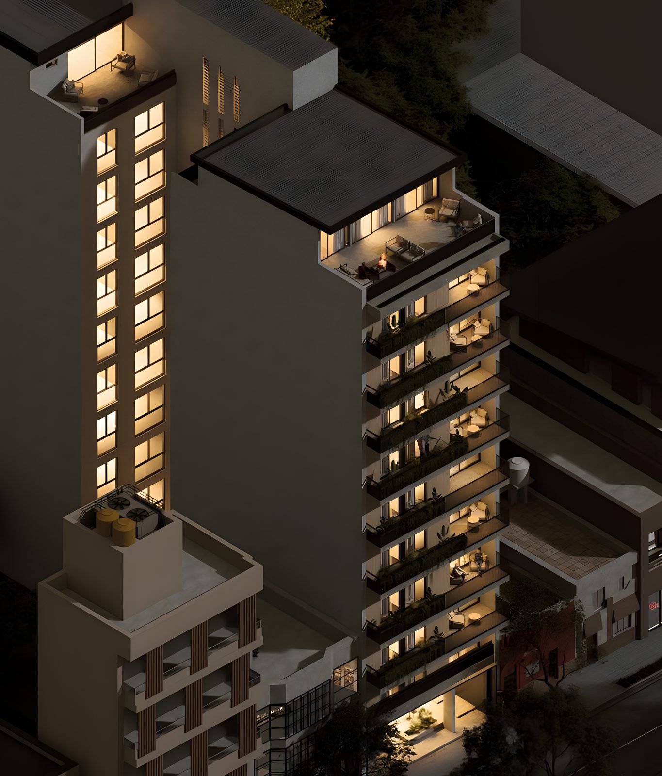 El edificio de noche, con los balcones iluminados