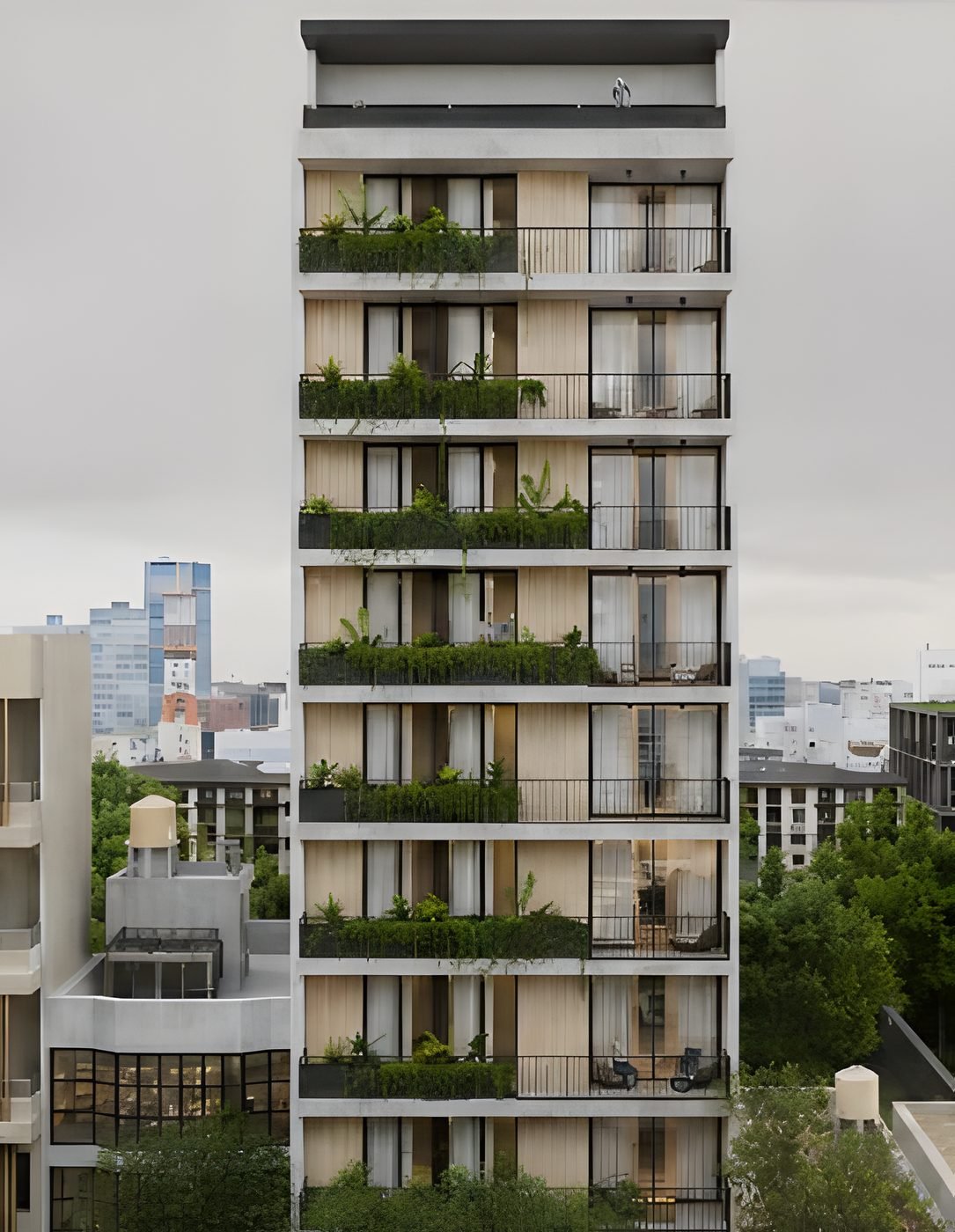 El edificio completo, con balcones con jardineras en todos los pisos